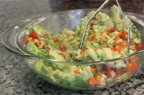 Chunky guacamole with tomatoes